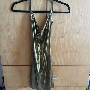 Gold, backless, sexy dress. High slits on side.